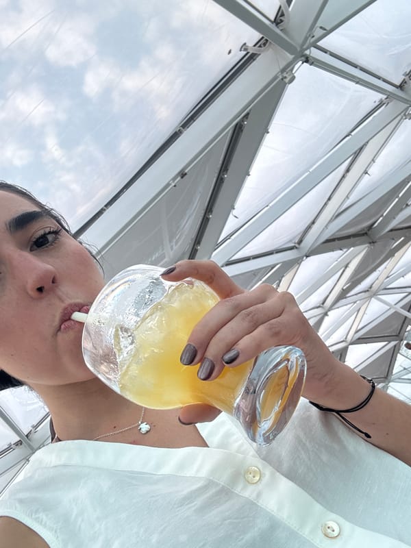 Woman enjoys yellow drink in Cape Canaveral area