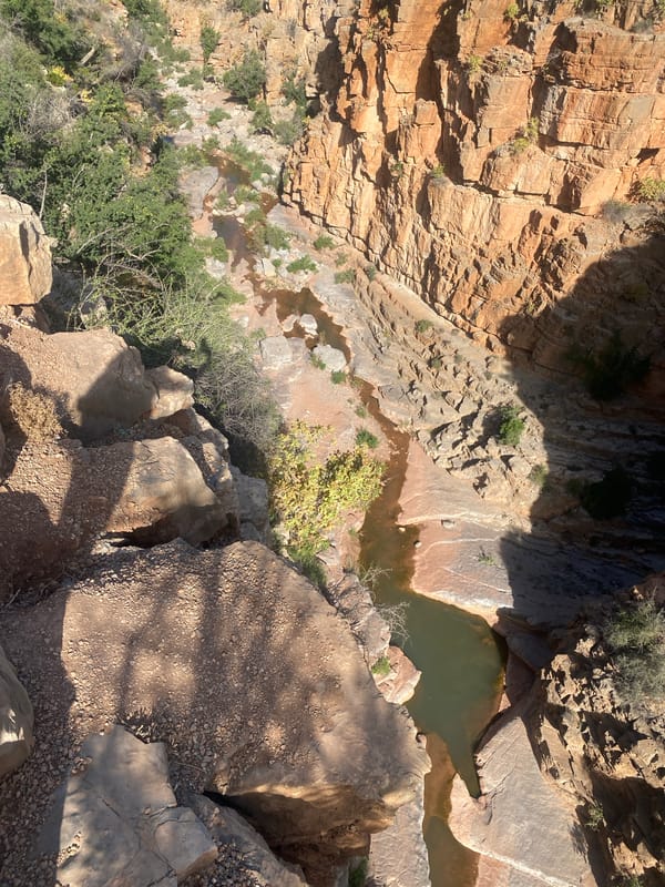 Hiker overlooks canyon gorge near Aqesri, Morocco