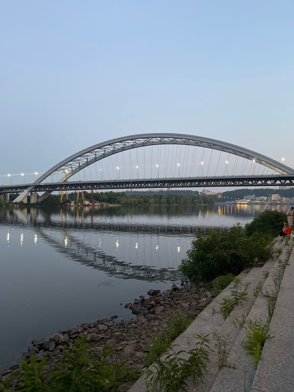 Kyiv's Southern Bridge and Dnipro River at dusk