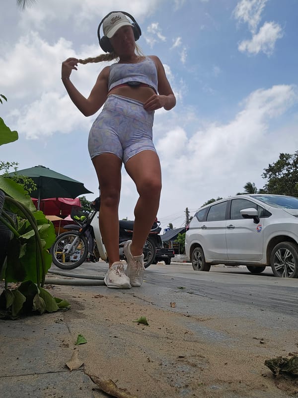 Morning stroll through Mũi Né's coastal streets in athletic wear