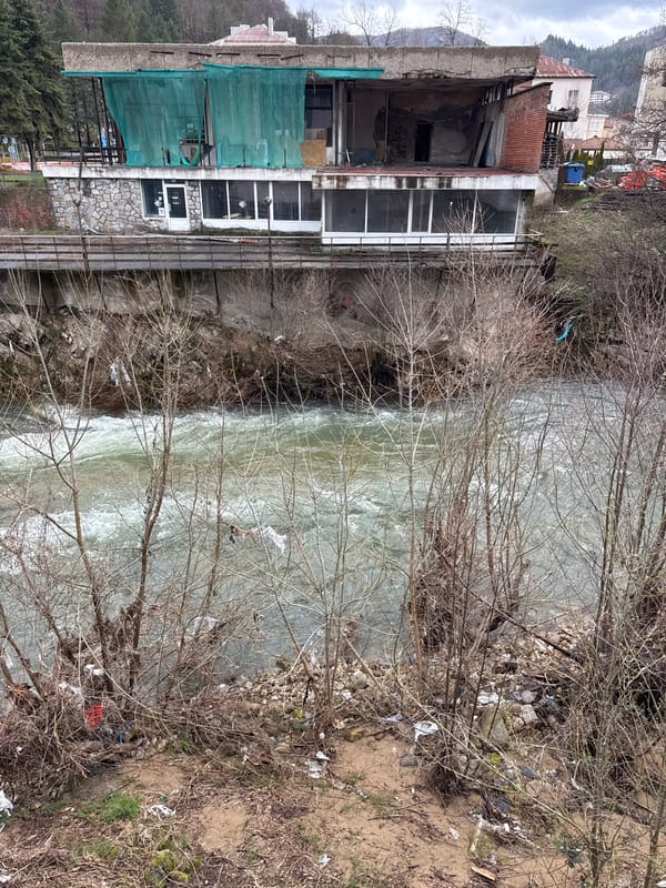 Fast-flowing river with debris observed in Rudozem, Bulgaria
