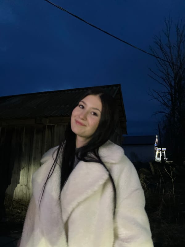 Woman poses for evening photos in white coat, Фоки Russia