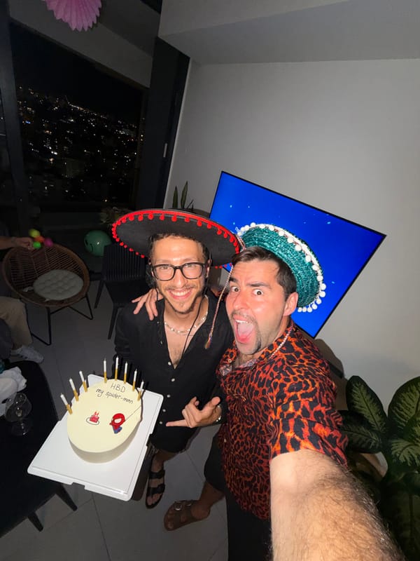 Sombrero selfie on a Tel Aviv balcony at night