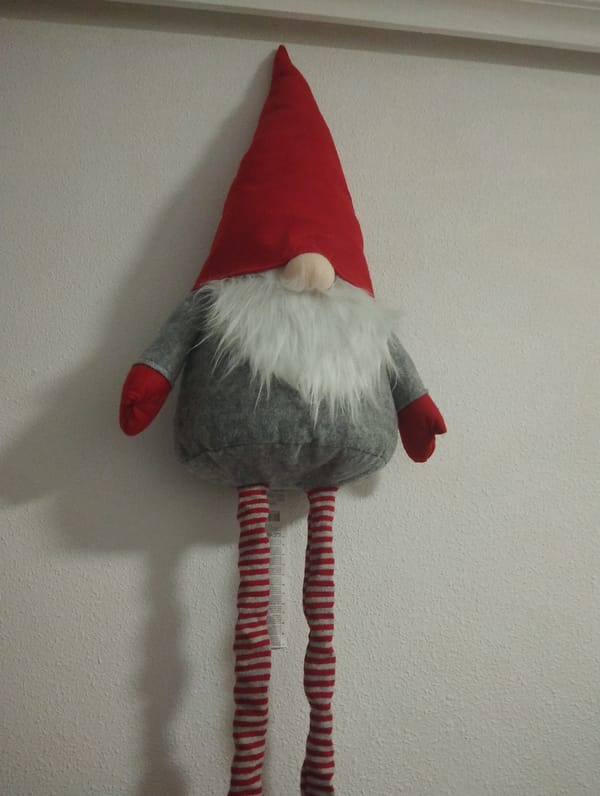 Decorative plush gnome spotted hanging on wall in Torrevieja