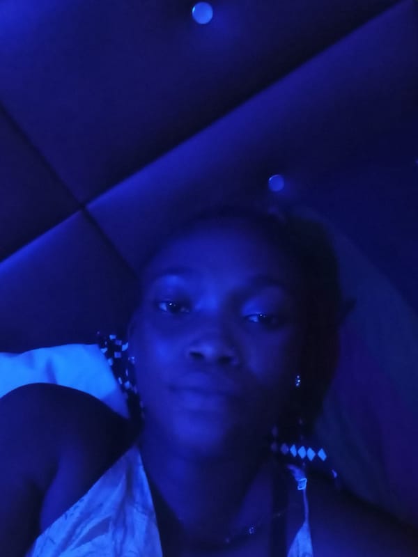 Blue-lit indoor portraits captured in Shagamu, Nigeria residence