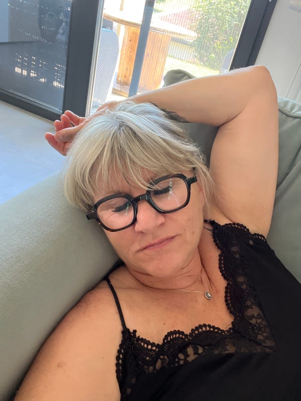 Woman rests, drinks water at home in Chambœuf