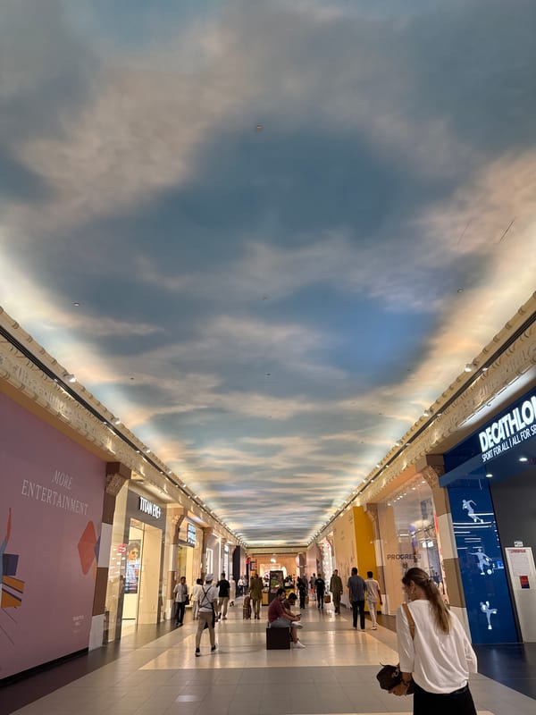 Dubai mall interior: painted ceilings, bold murals, retail corridors