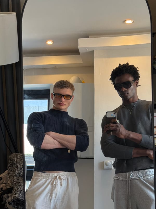 Two men take mirror selfies in London