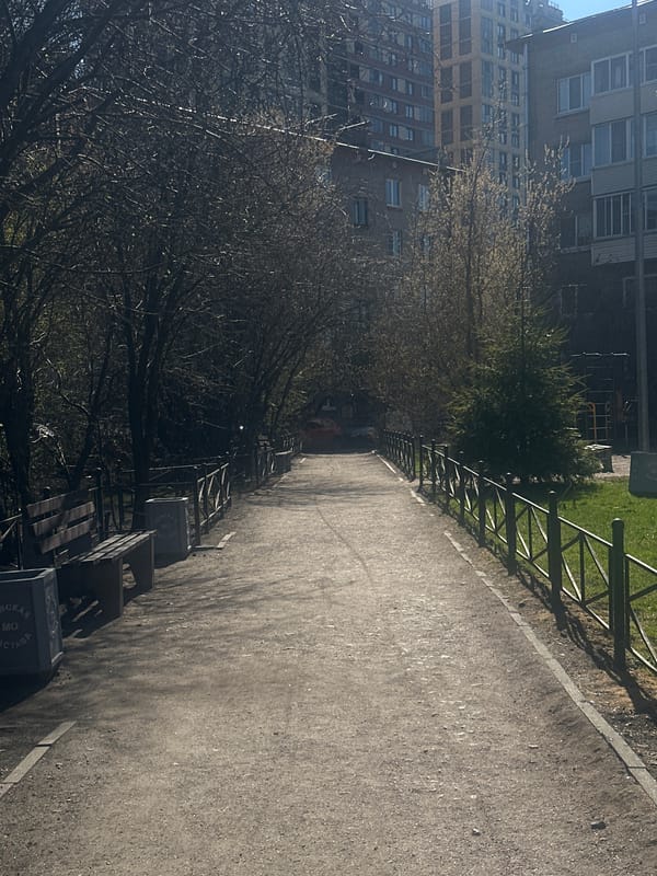 Pedestrian walkway with metal fencing observed in Saint Petersburg
