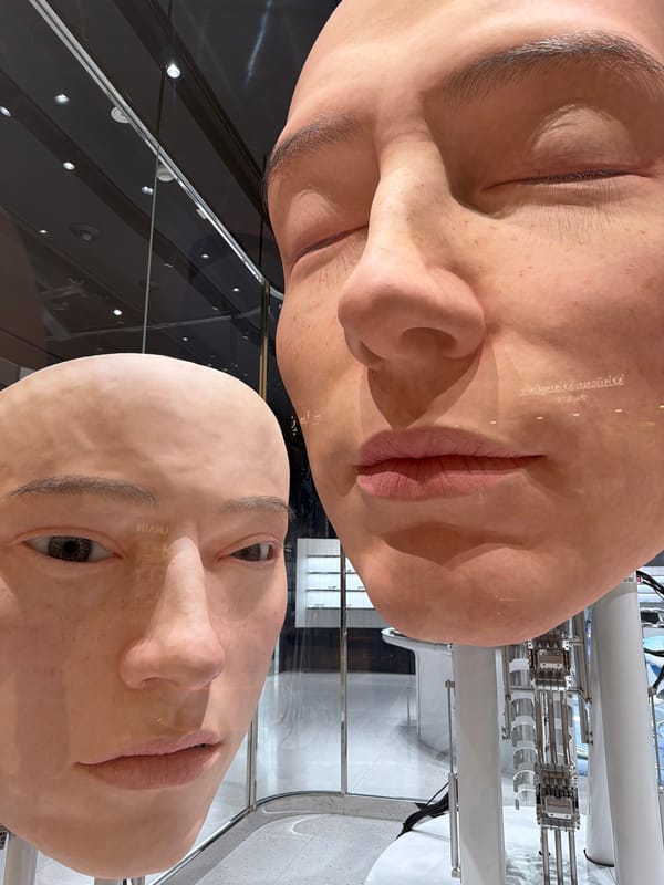 Oversized mannequin head sculptures on display in Dubai