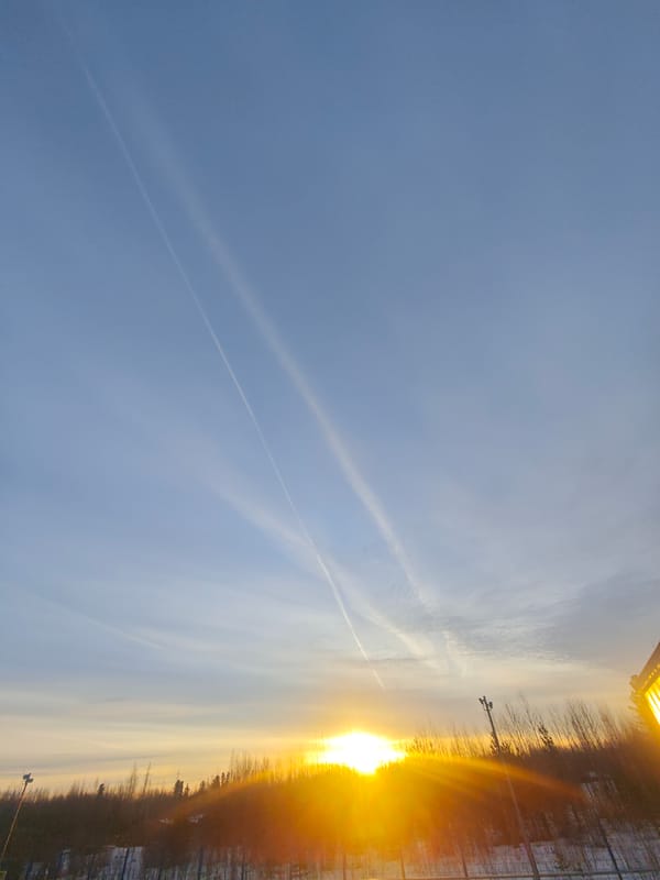 Russian industrial worker documents dawn shift in winter landscape