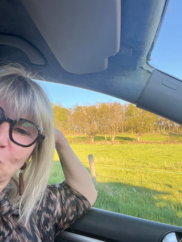 Woman takes selfies during skincare routine in French village