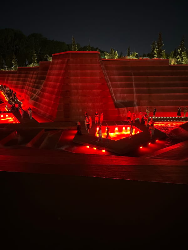 Krasnodar's red-lit tiered plaza draws an evening crowd