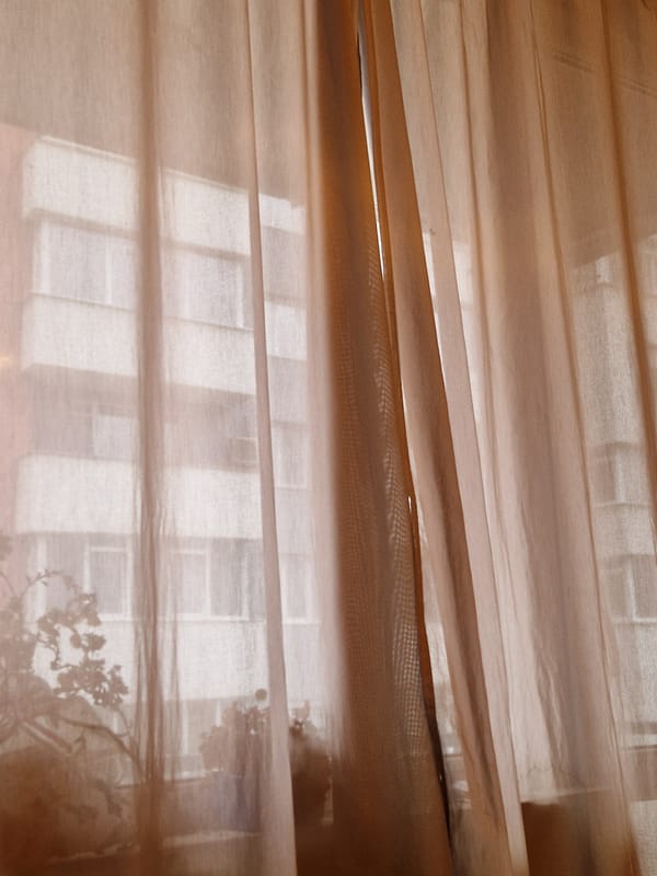 Morning light filters through sheer curtain in Lovech