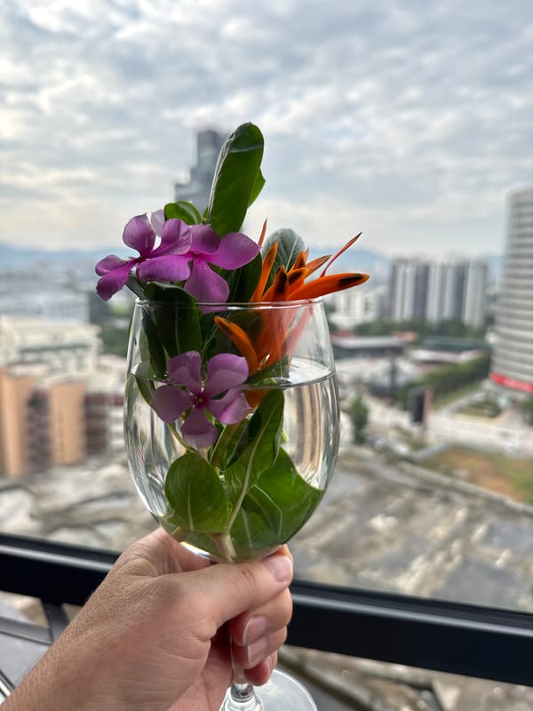 Flowers held against the Kuala Lumpur skyline