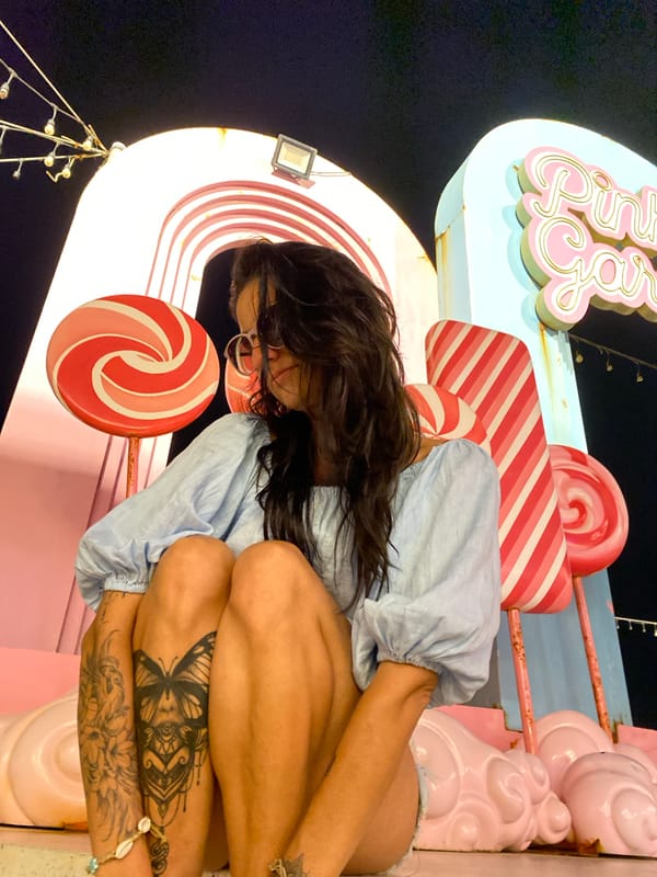 Woman poses at candy-themed attraction in Vietnam