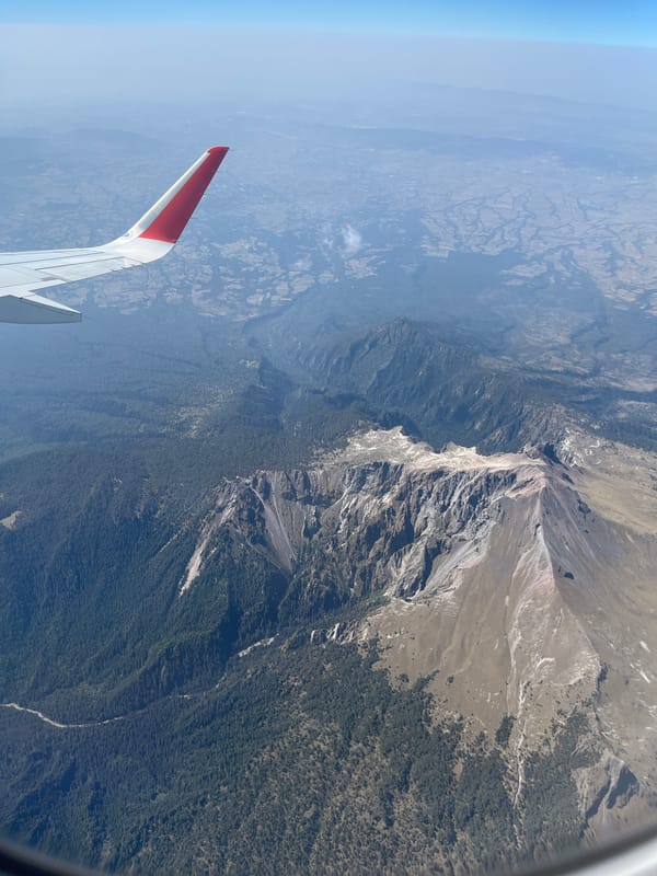 Aerial view captured of Mexican mountains from banking aircraft