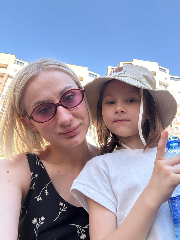 Woman and child take selfies in Pushkino park