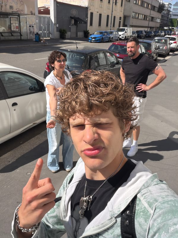 Street scene photographed in Milan shows young person, others