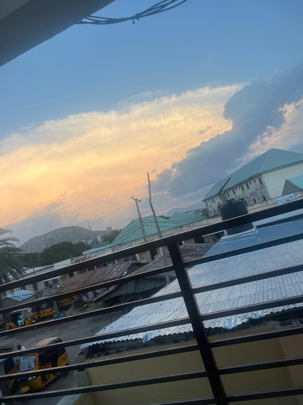Jalingo at golden hour, streets and skyline under sunset clouds