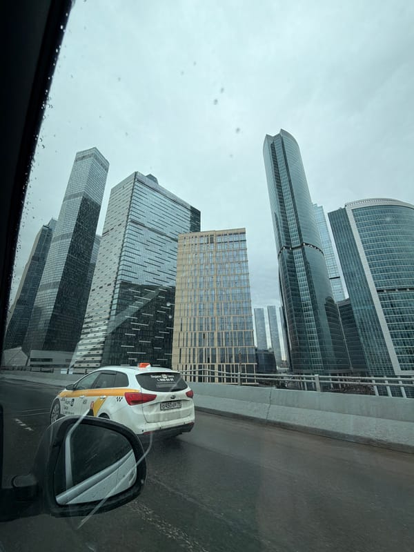 Rainy day view of Moscow City skyscrapers from vehicle
