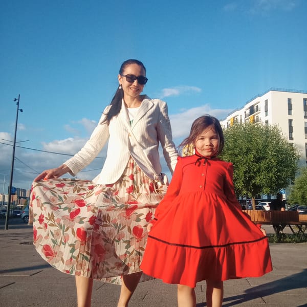 Woman and girl enjoy sunny afternoon in Pervomaysky