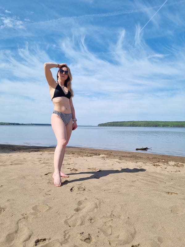 Woman enjoys beach time in Chaikovsky, Russia