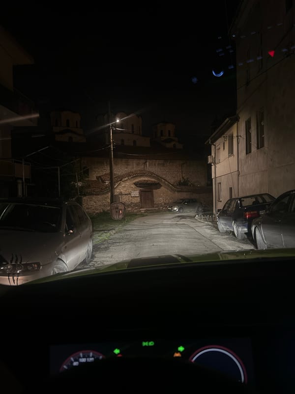 Taxi ride documented through urban streets during evening hours