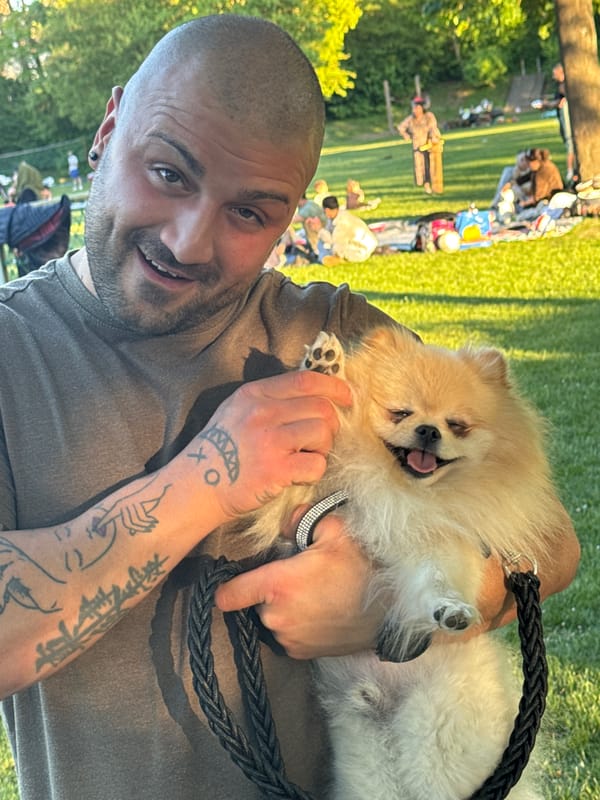 Man enjoys outdoor moment with fluffy Pomeranian in Ditzingen