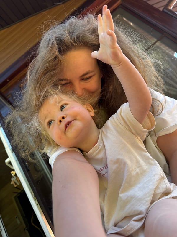 Family relaxes on deck during sunny morning in Копнино