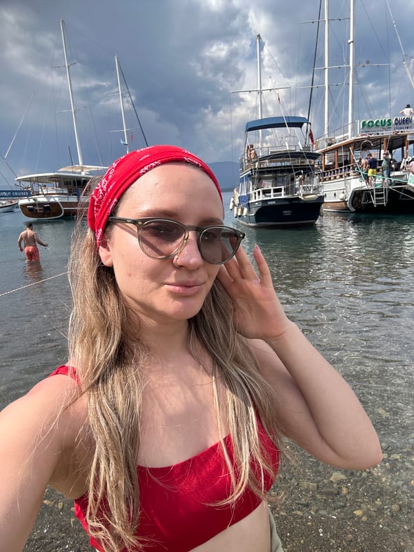 Tourist photographs herself at multiple Fethiye harbor locations