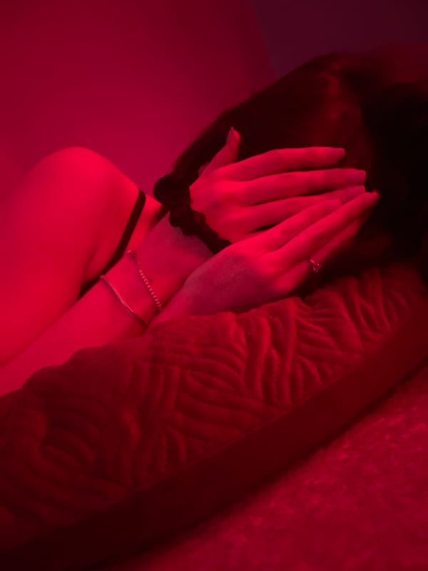 Red-lit indoor hangout, Gliwice, late evening