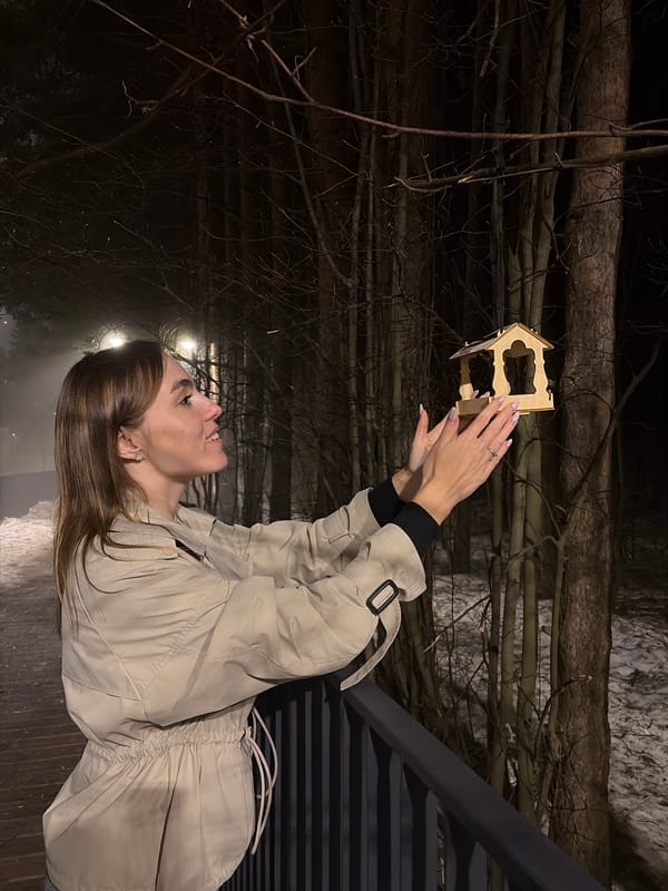Woman poses on bridge during foggy evening in Izhevsk