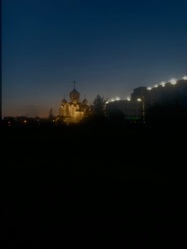 Evening stroll documented near Orthodox church in Vsevolozhsk, Russia