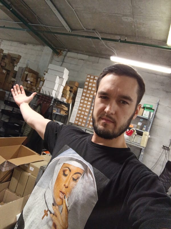 Man documents warehouse inventory in Moscow storage facility