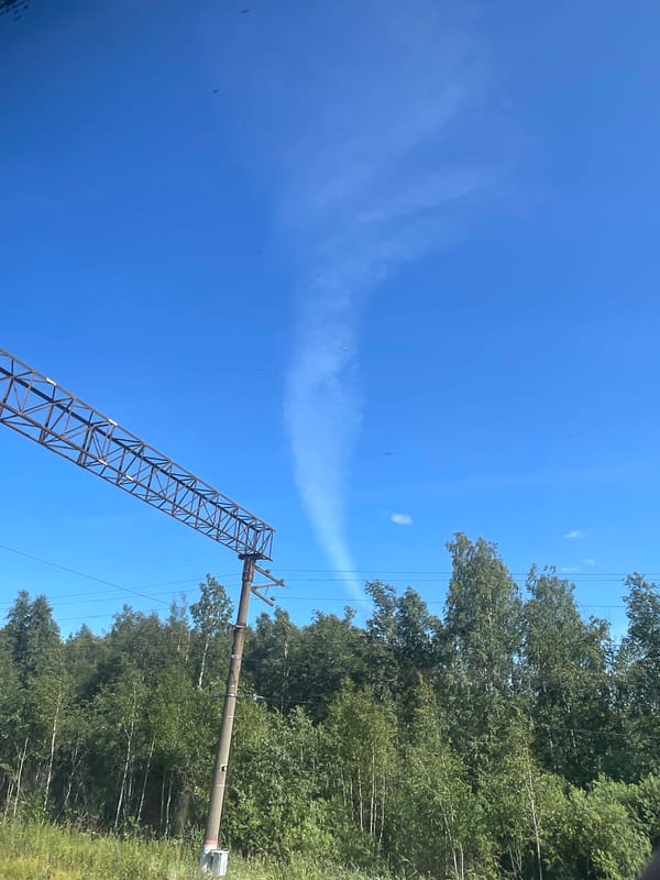 Diesel train and passing skies in Sosnoviy Bor