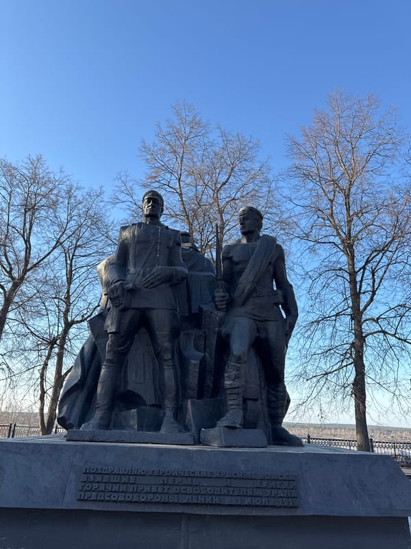 Tourists explore monuments and feed pigeons in Perm, Russia