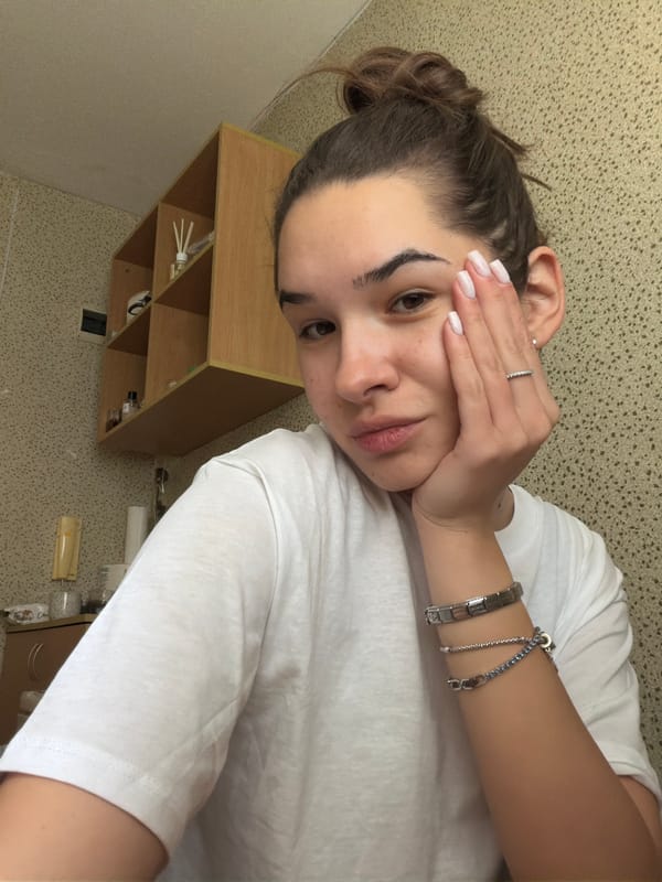 Woman takes indoor selfie in Sofia wearing white shirt