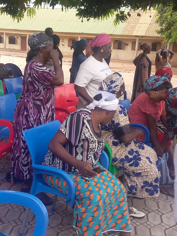 Community gathering documented in Akwanga courtyard, April 2026