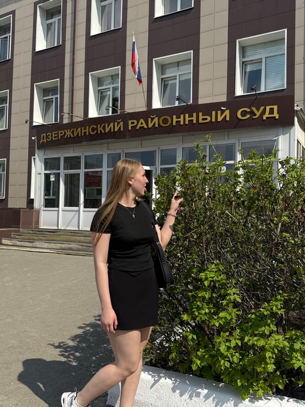 Woman photographed outside district court building in Perm, Russia