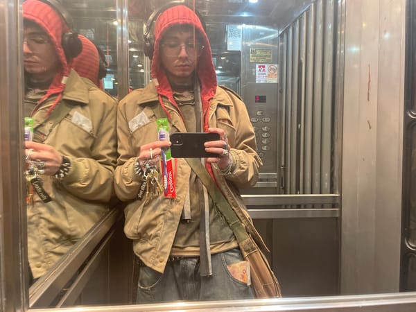 Person takes elevator selfie with toothbrush in Buenos Aires