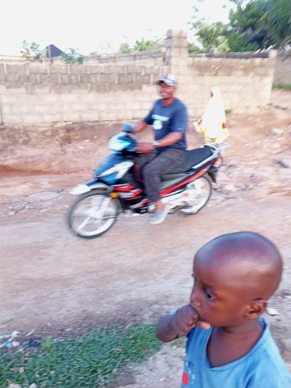 Daily life unfolds on dirt roads in Zango-ndaji, Nigeria