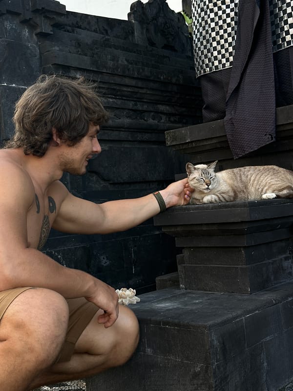 Red-haired tourist explores North Kuta streets, temples, local animals