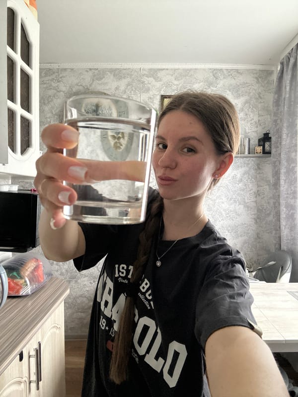 Woman enjoys morning breakfast routine in Klin kitchen