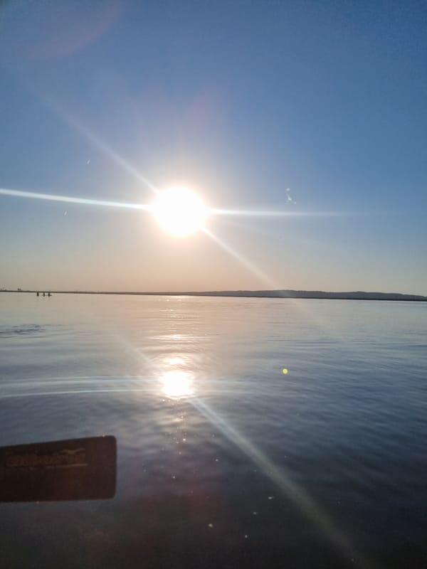 Sunny afternoon captured over water in Chaikovsky, Russia