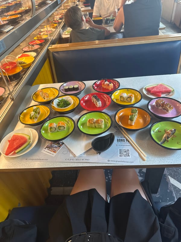Diners enjoy conveyor belt sushi restaurant in Madrid
