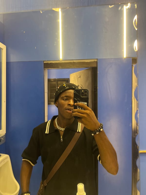 Person Takes Multiple Selfies at Nigeria Venue During Evening