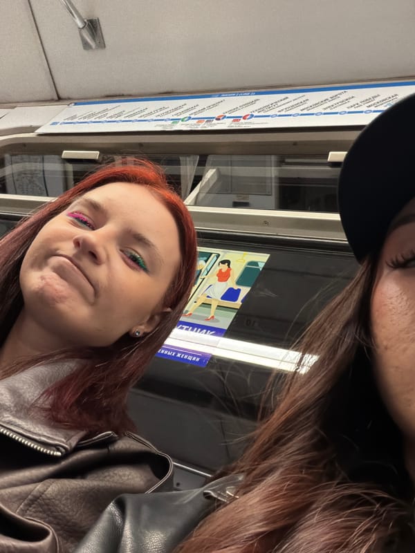 Young women photographed on subway during morning commute
