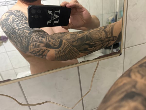 Person takes bathroom mirror selfie in Trier