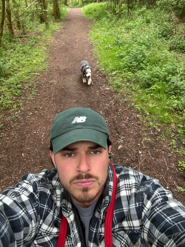 Man takes trail selfie, photographs dog during morning hike